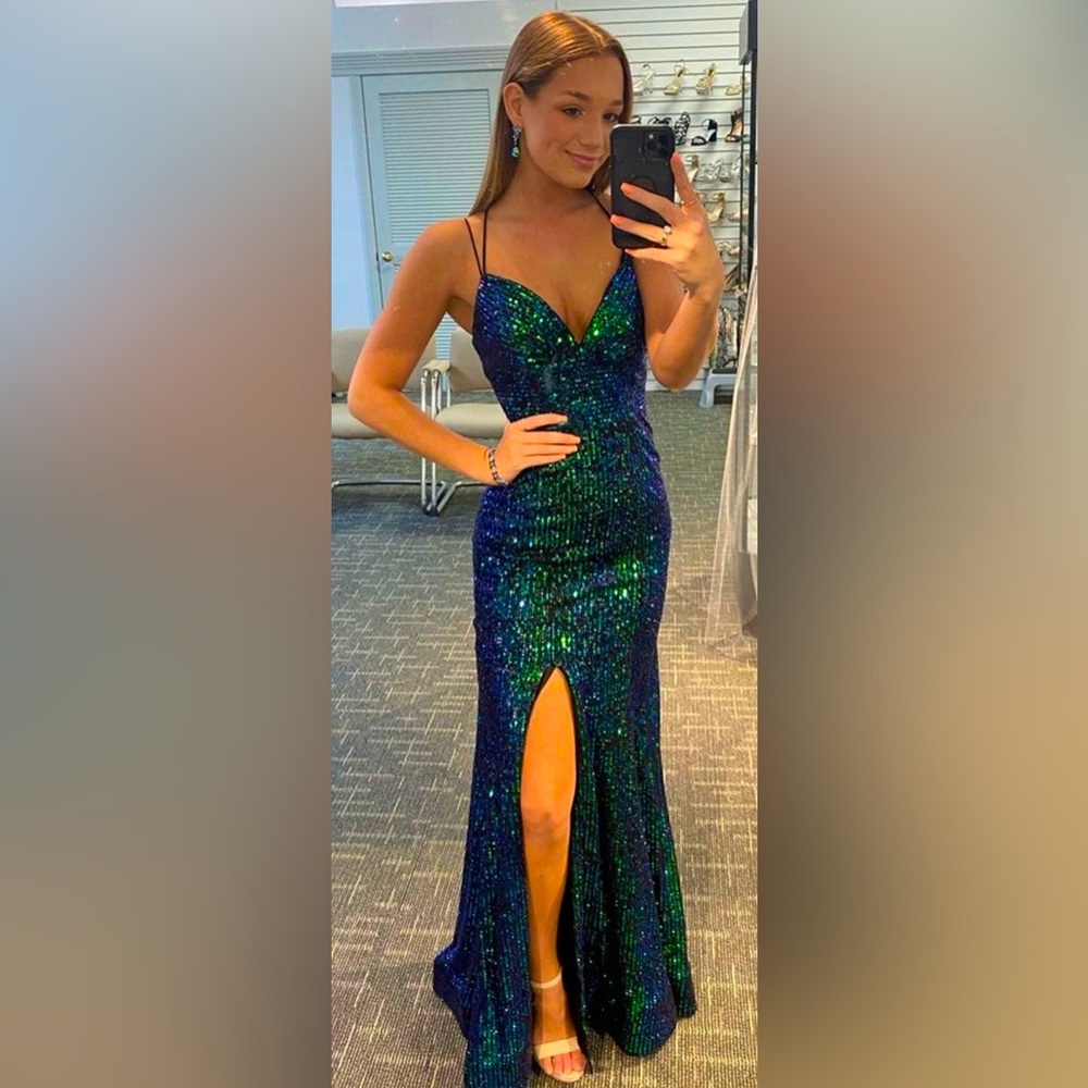 Size 2 beautiful evening gown. Worn once and in excellent condition